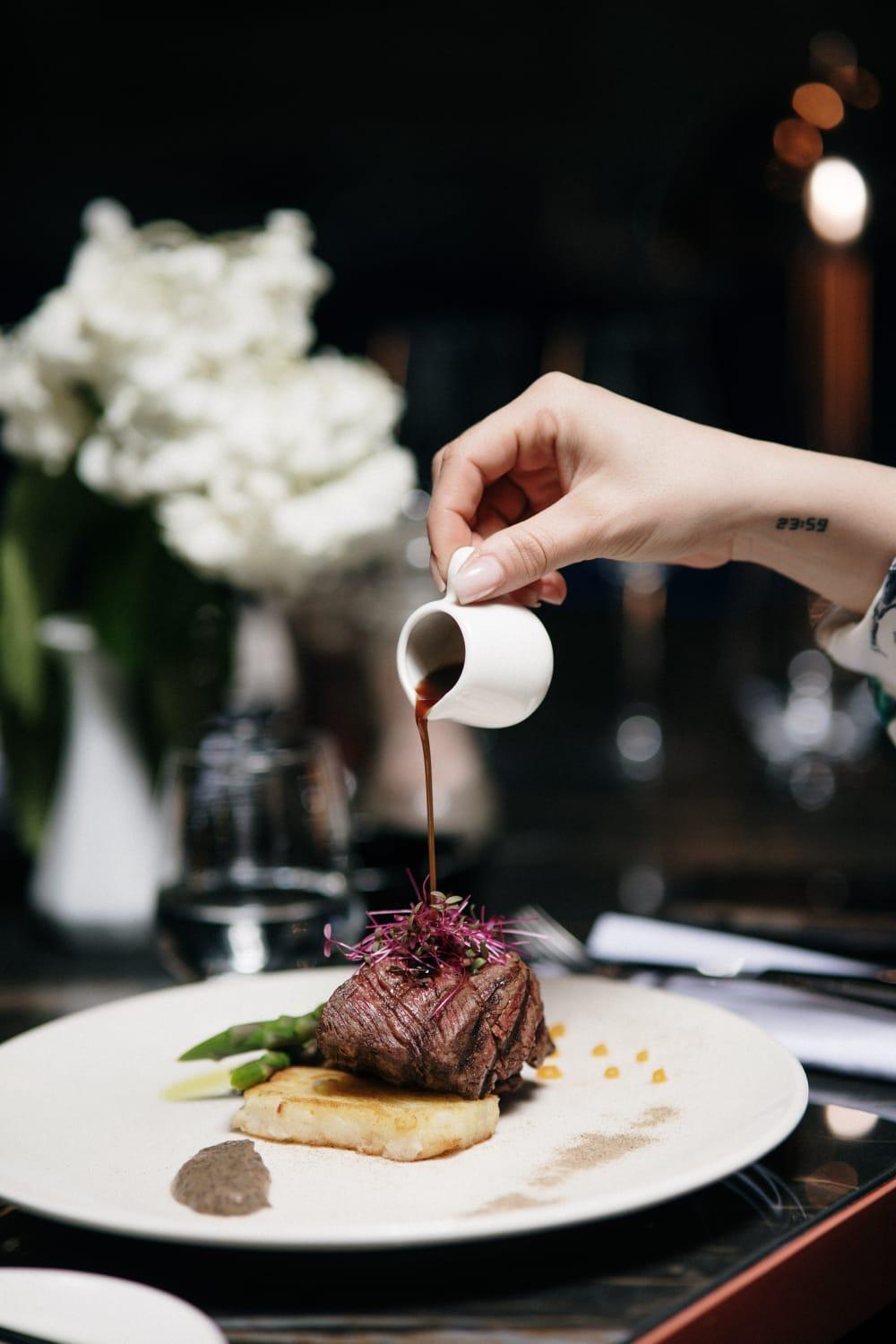 Xheko Imperial Luxury Hotel & Spa Tirana Exterior foto A server pours soy sauce onto a dish